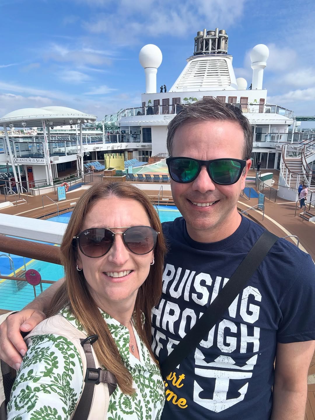 Couple on the deck of a cruise ship sailing through the Greek Isles